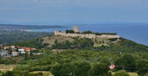 The Byzantine Castle of Platamon In the Municipality Dion-Olympus in Pieria region with trees and sea from the top.
