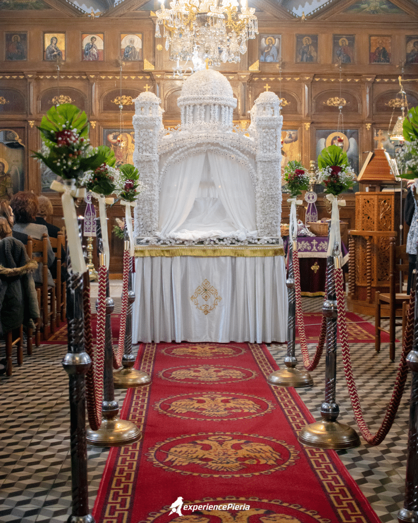 The Epitaph is decorated with flowers inside the church of Agios Georgios.