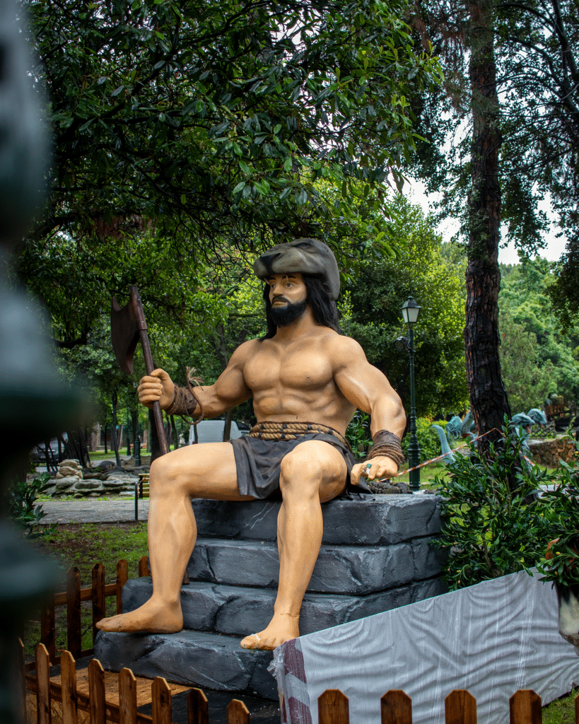 Hercules's statue sits and holds a chopper, the 12 labors of Hercules, Katerini's events, Pieria region.