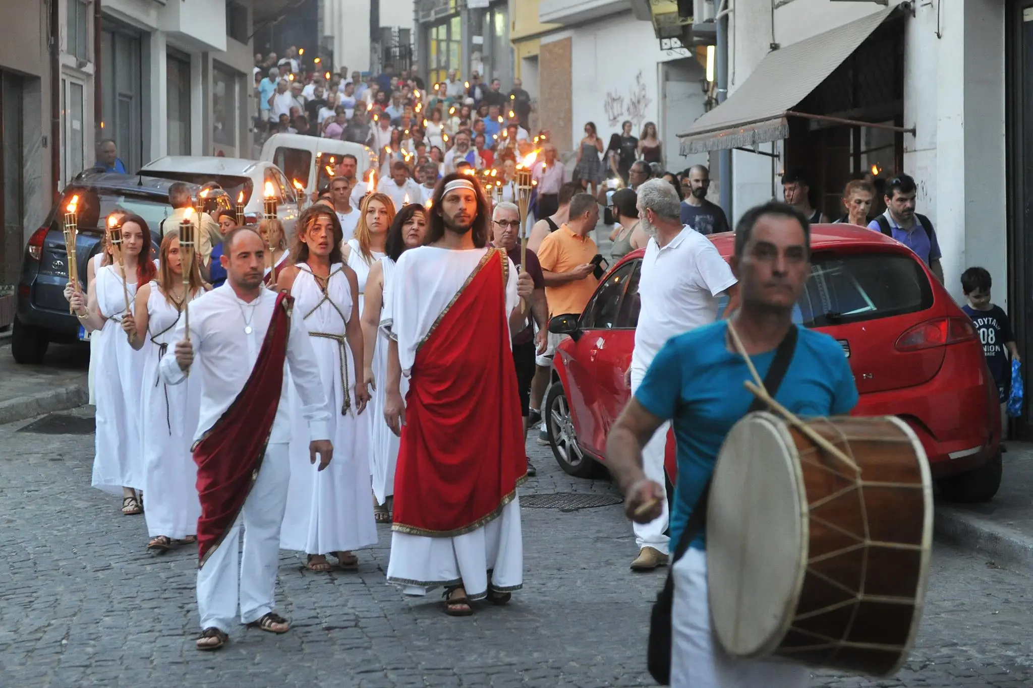 People wearing ancient Greeks clothes as a celebration of Prometheia Festival on one of pieria region streets