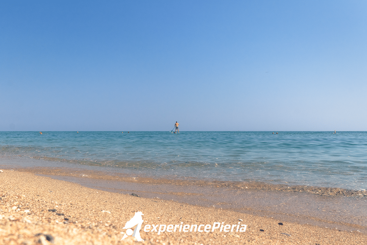 man paddling in Panteleimon Beach, Pieria region, Greece