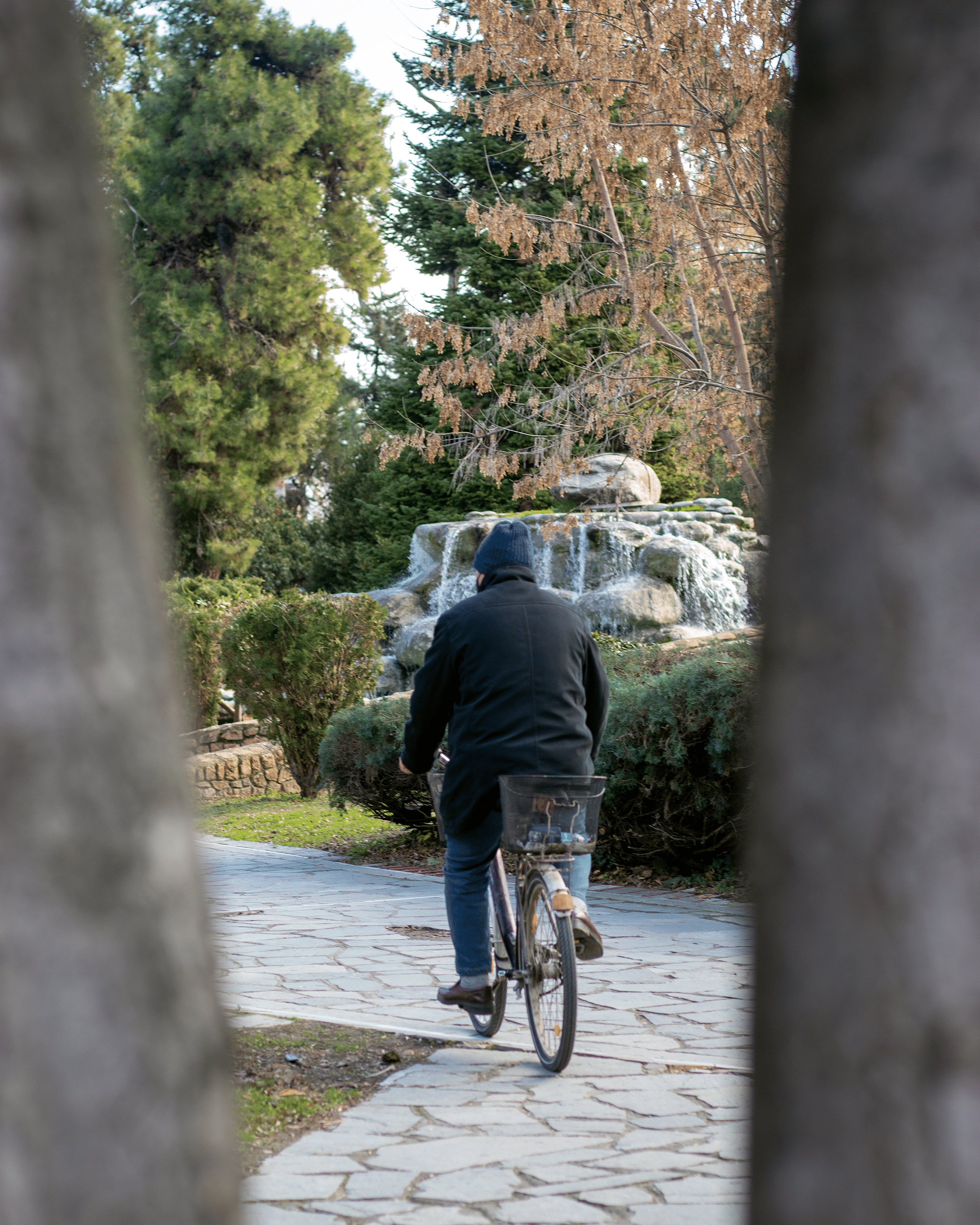 a guy on a pike strolling around Katerini municipal park during autumn in Pieria.