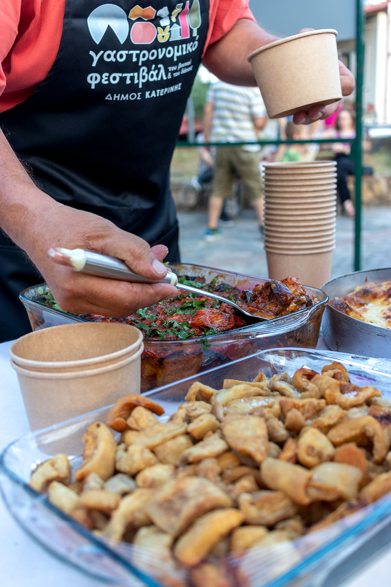Local chef serving wild boar portions at Gastronomy Festival Pieria