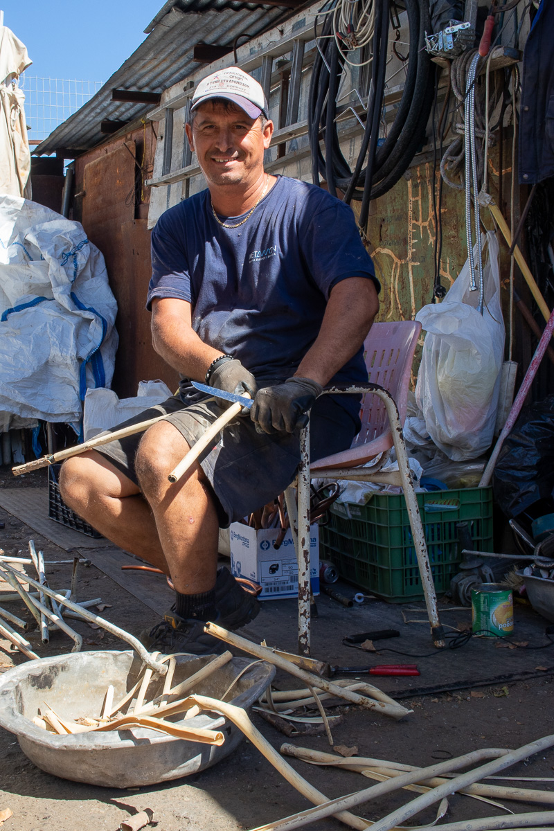 Worker stripping copper