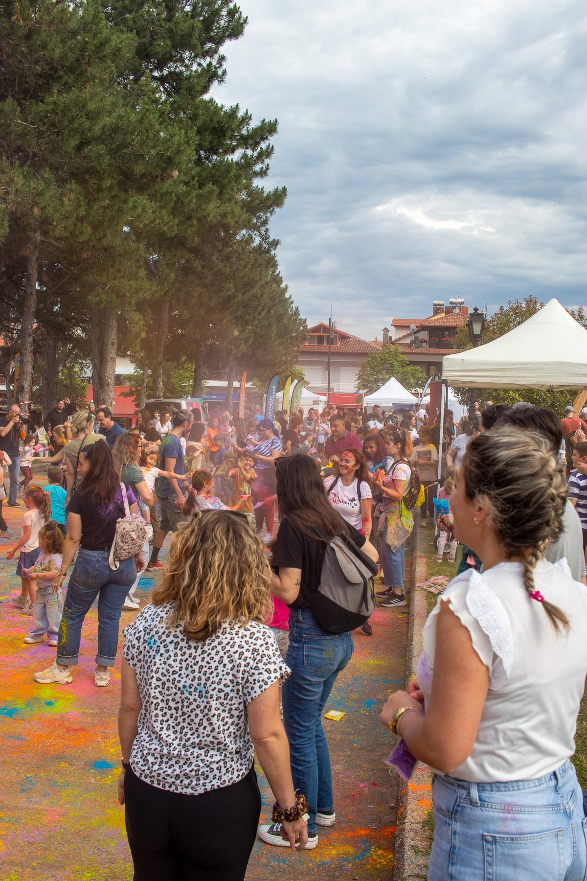 Kids and crowd playing color fight in Litochoro park