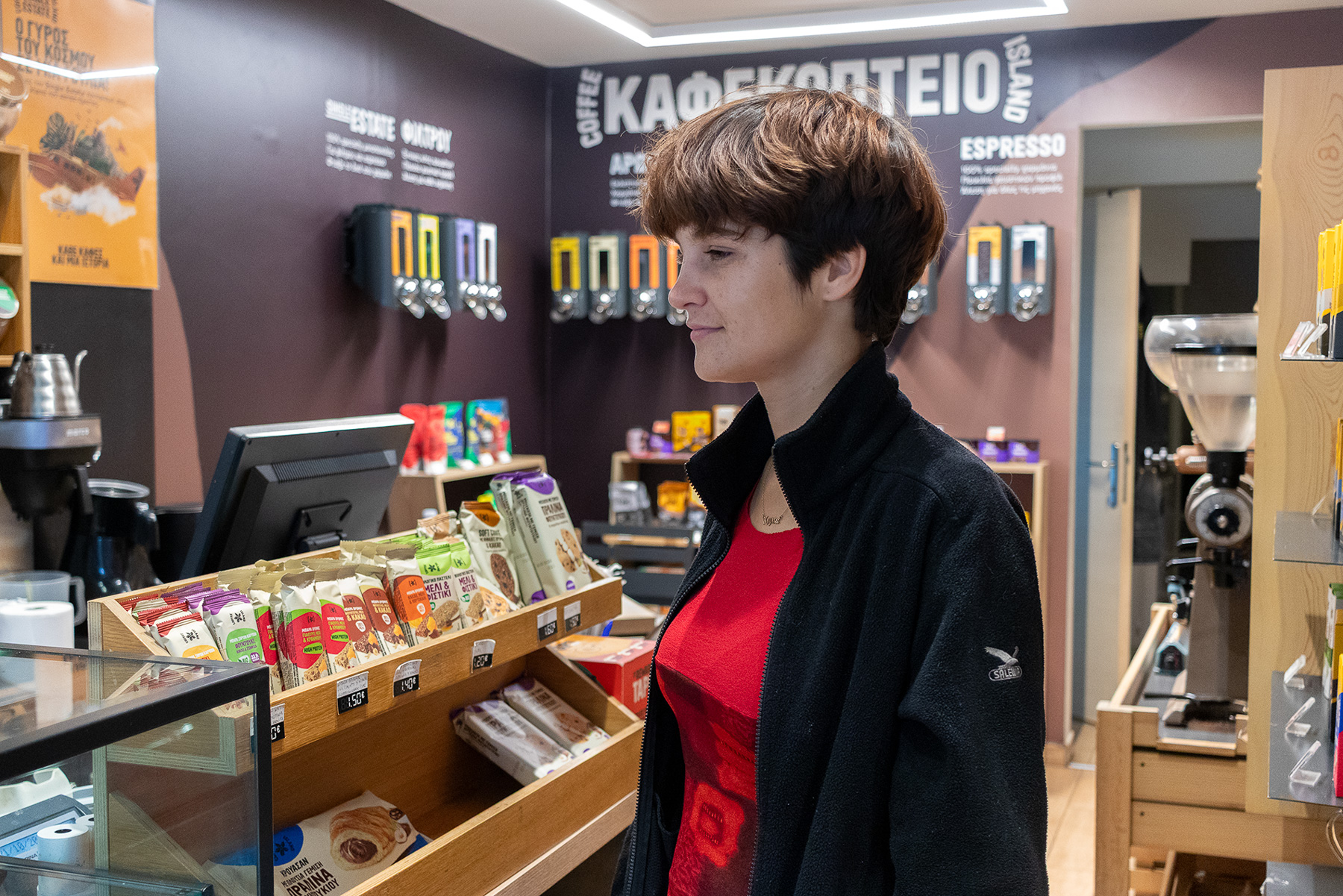 Anna smiling while waiting for her freddo espresso at Coffee Island in Katerini Pieria Greece