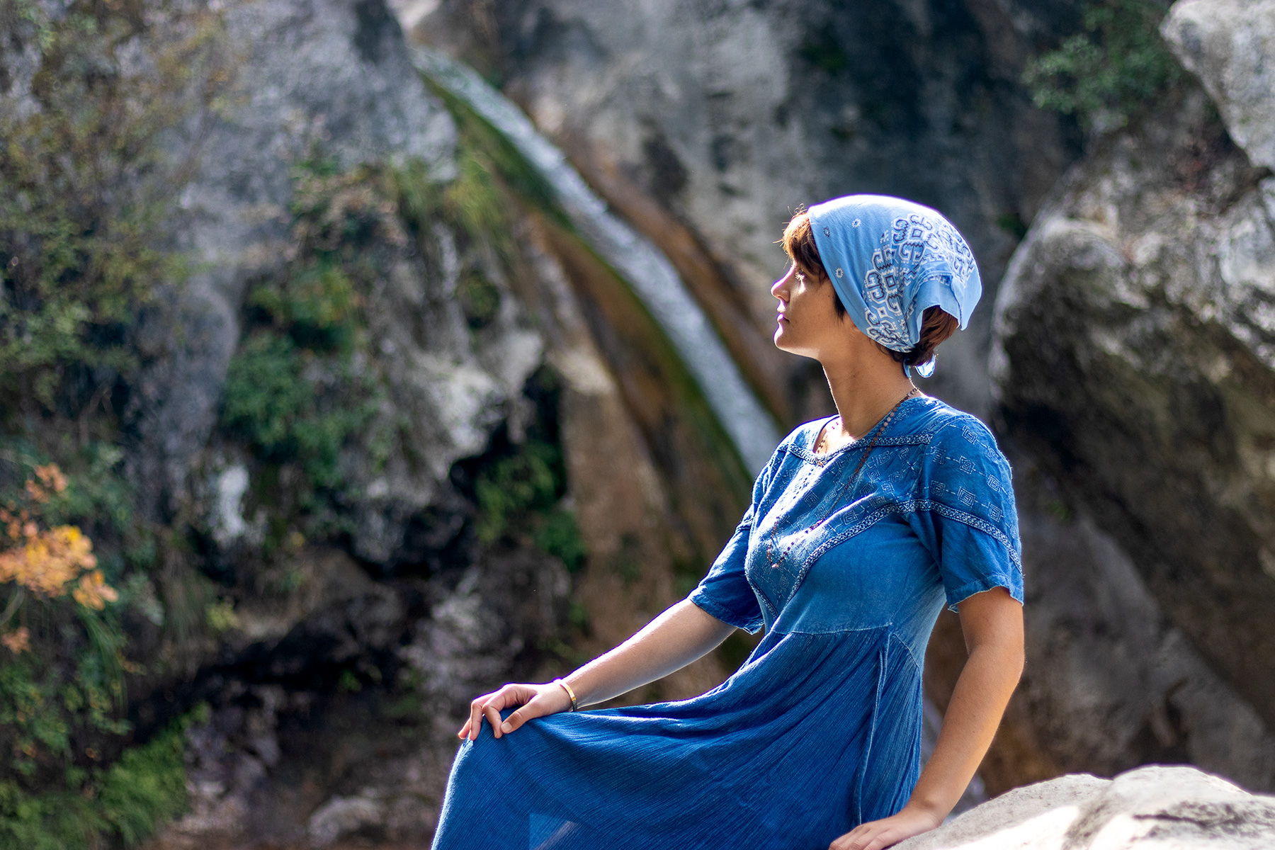 Anna at Agia Kori waterfall, Pieria Greece, looking up toward the light