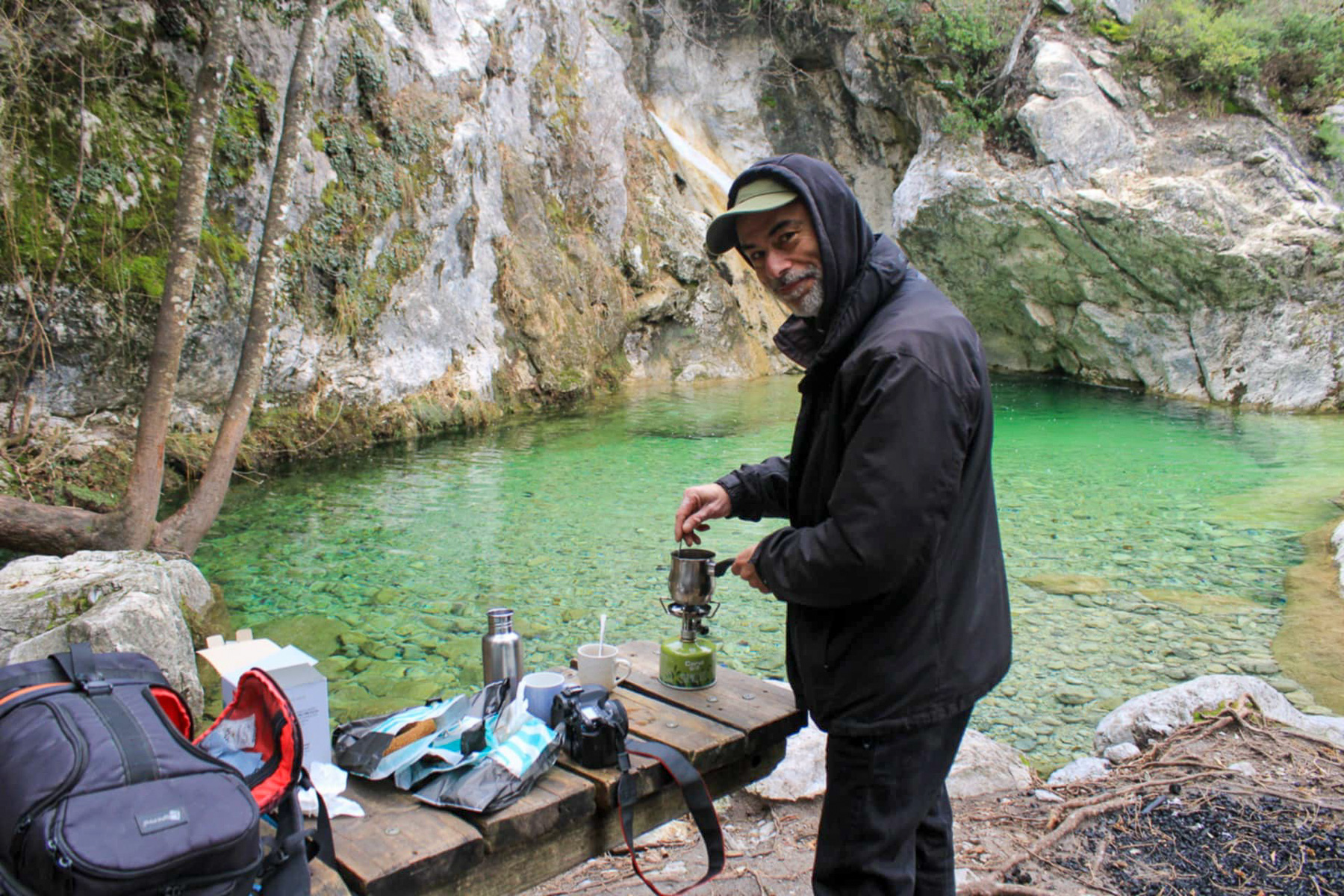 Giorgos Gizelis making Greek coffee outdoors near Agia Kori waterfall, Olympus