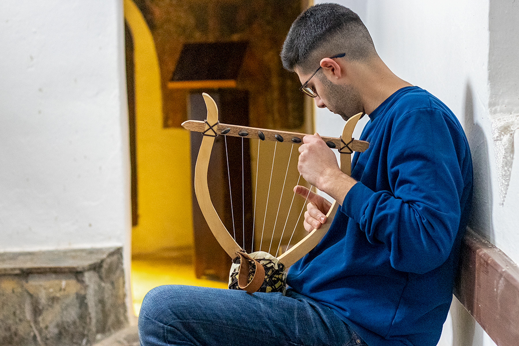 Christos Kyparissas playing handmade lyra at Agia Triada, Vrontou