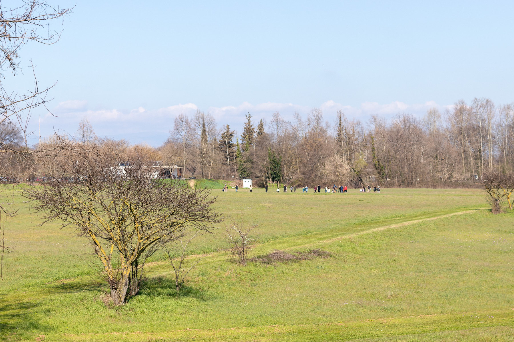 Visitors walking toward the Hellenistic theatre of Dion, Pieria, Greece