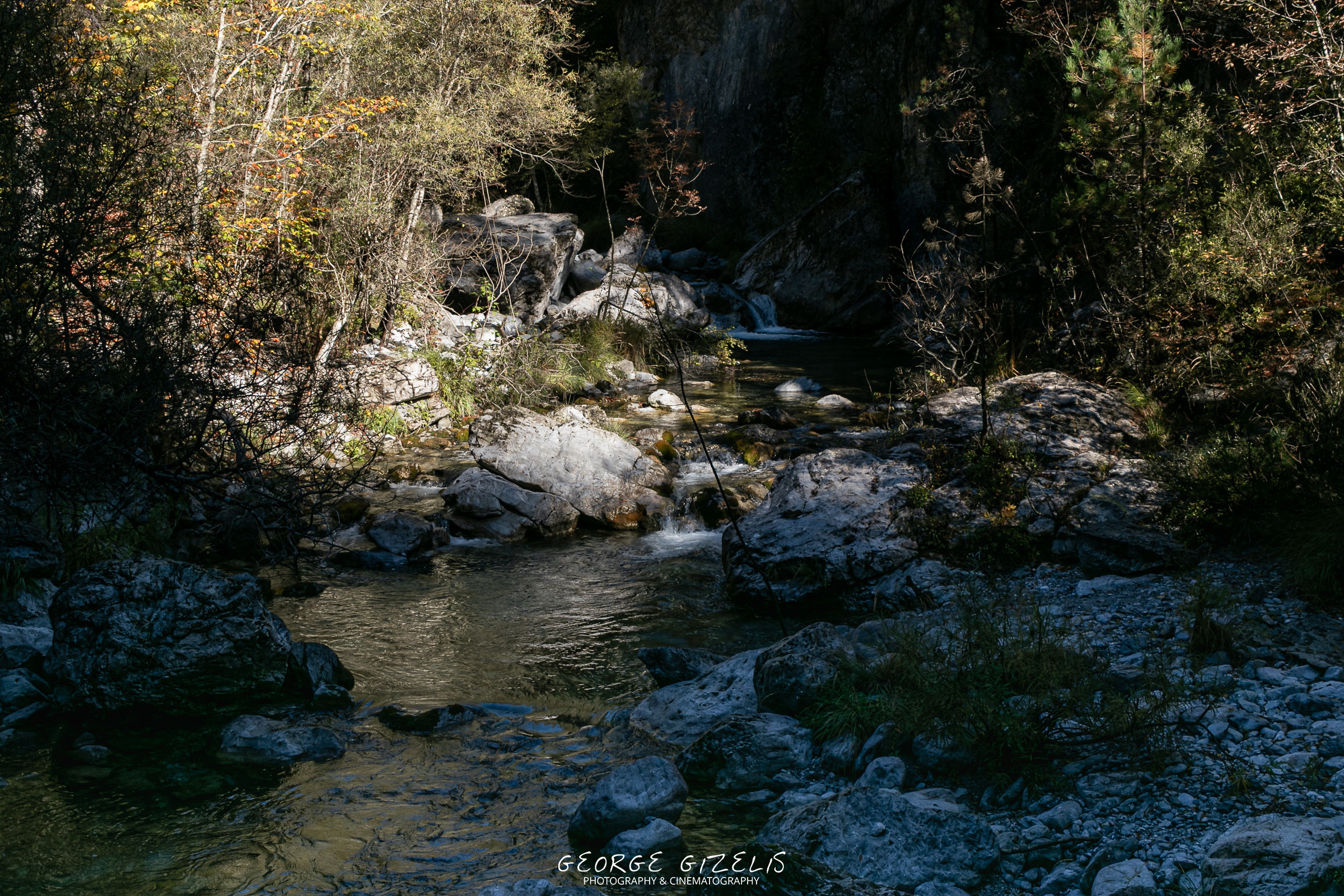 The Enipeas River viewed from a wooden footbridge along the forest path on Mount Olympus.